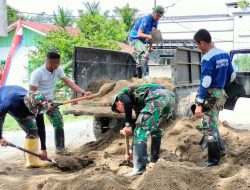 Satgas TMMD Ke 115 Kodim 0313/KPR Tak Henti -hentinya Melangsir Material Kerikil dan Pasir