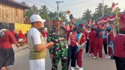 Babinsa dan Camat Pendalian Ikuti Karnaval Jalan Santai Semarak HUT RI Ke-81